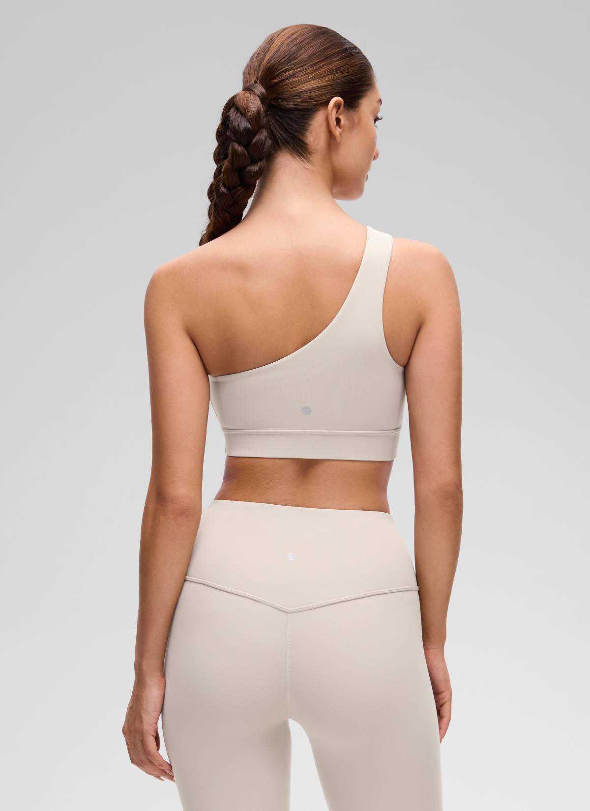 CRZ YOGA Butterluxe Womens One Shoulder Sports Bra Asymmetrical Padded Mojave Tan @model_info:Inga