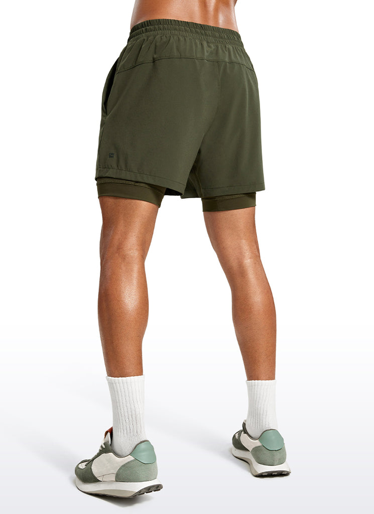 CRZ YOGA Men's Train Relaxed Fit Feathery-Fit 2 in 1 Shorts 5'' with Long Liner Dark Olive