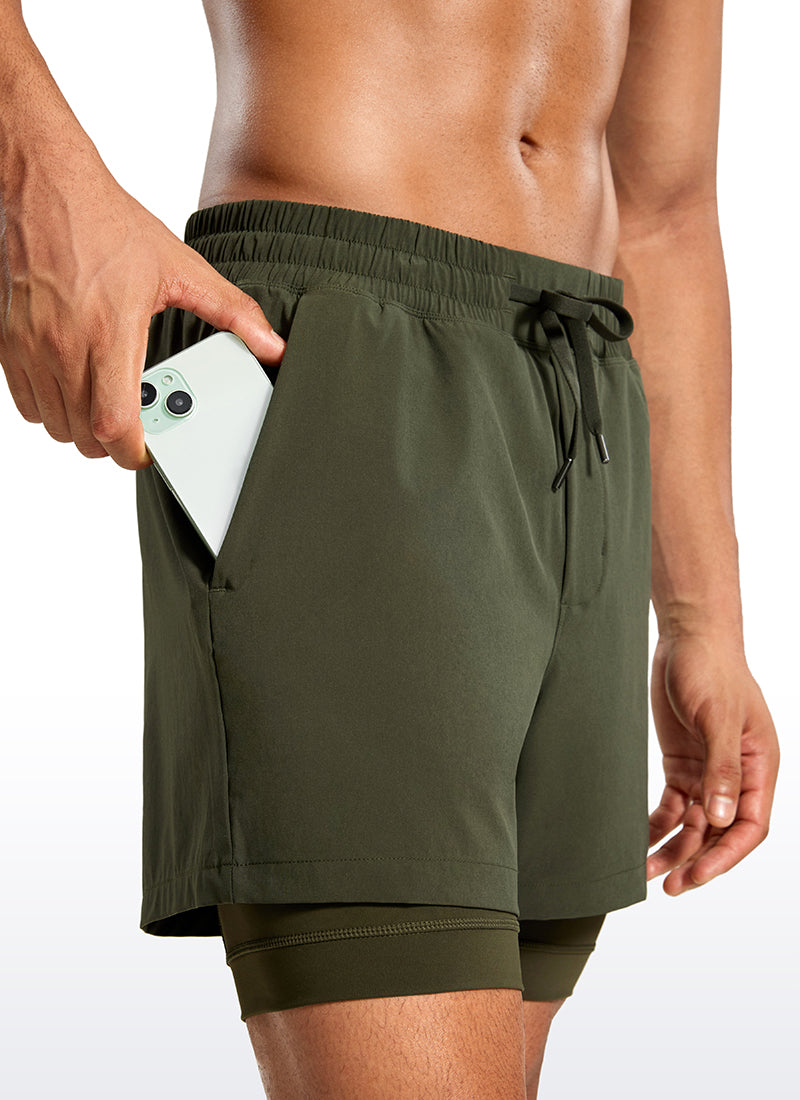 CRZ YOGA Men's Train Relaxed Fit Feathery-Fit 2 in 1 Shorts 5'' with Long Liner Dark Olive