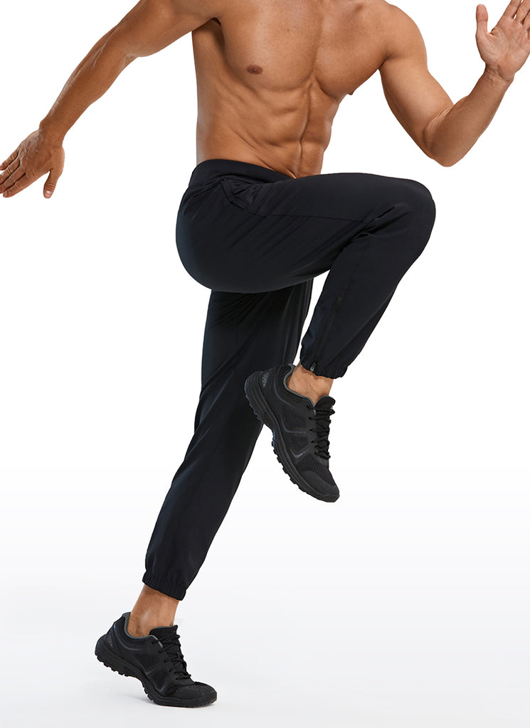 CRZ YOGA Men's Run Slim Fit On the Travel Joggers 28''- Ankle Zipper Black