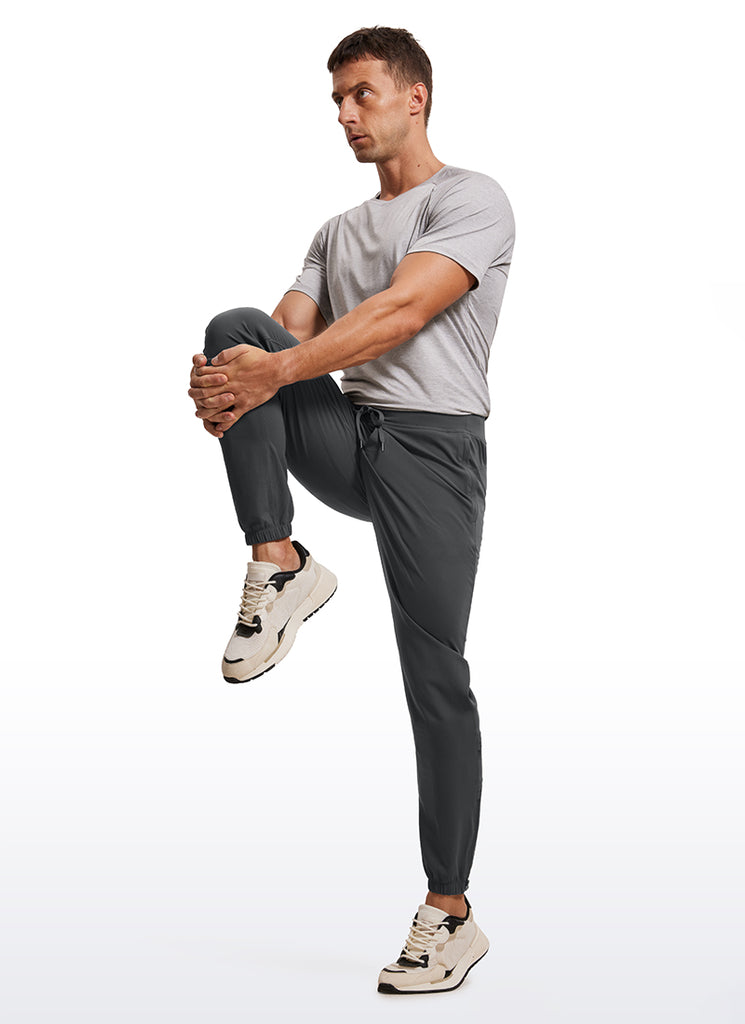 CRZ YOGA Men's Run Slim Fit On the Travel Joggers 32''- Ankle Zipper Melanite