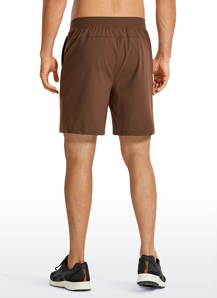 CRZ YOGA Men's Train Relaxed Fit On the Travel Linerless Shorts 7'' Dark Brown