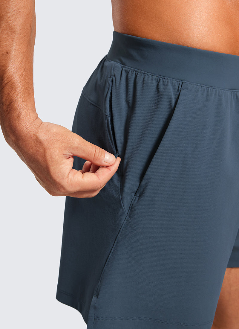 CRZ YOGA Men's Quick Dry Lightweight Gym Shorts with Zipper Pocket Stelindigo