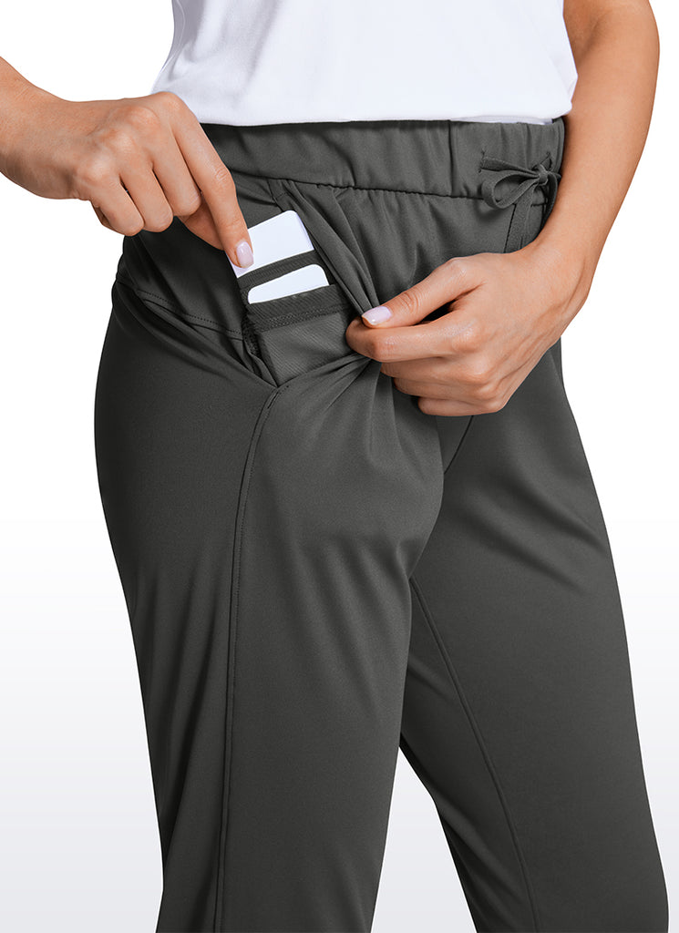 CRZ YOGA Women's Travel Slim Fit Stretch Drawstring Jogger 27'' Dark grey camouflage