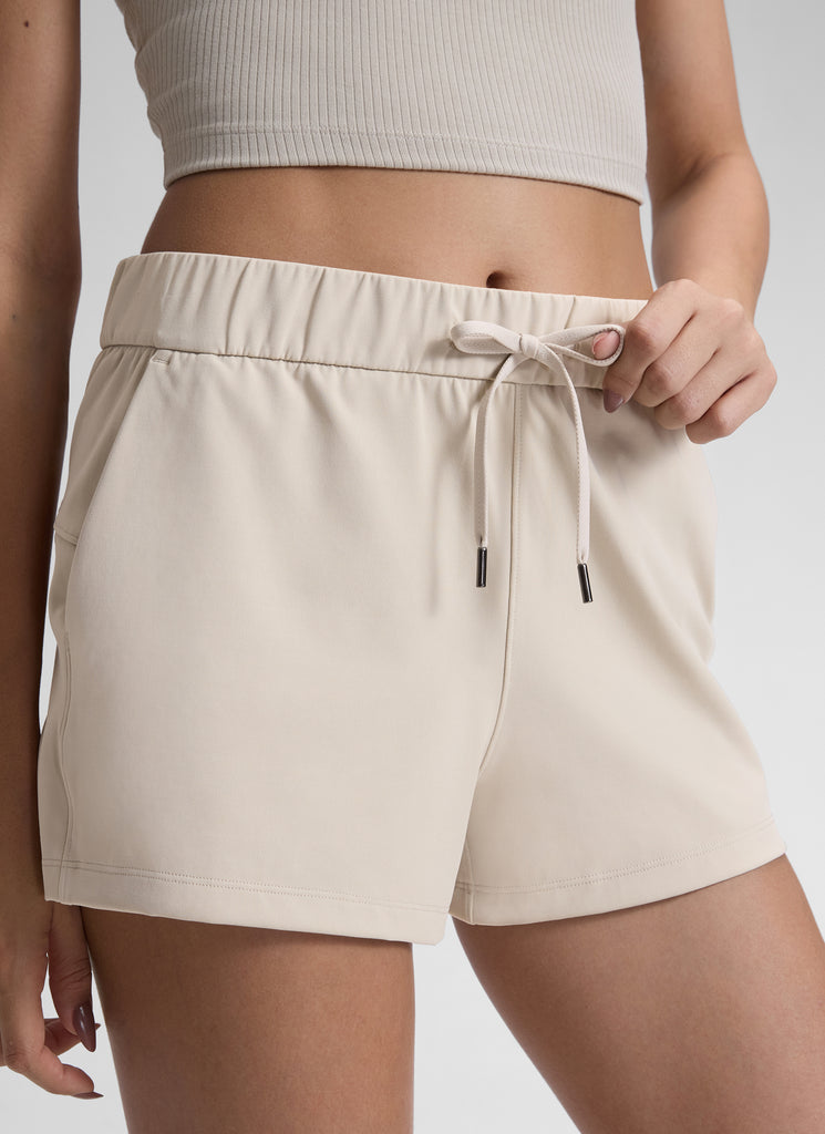 CRZ YOGA Women's Travel Stretch Mid-Rise Drawstring Shorts 2.5" Mojave Tan