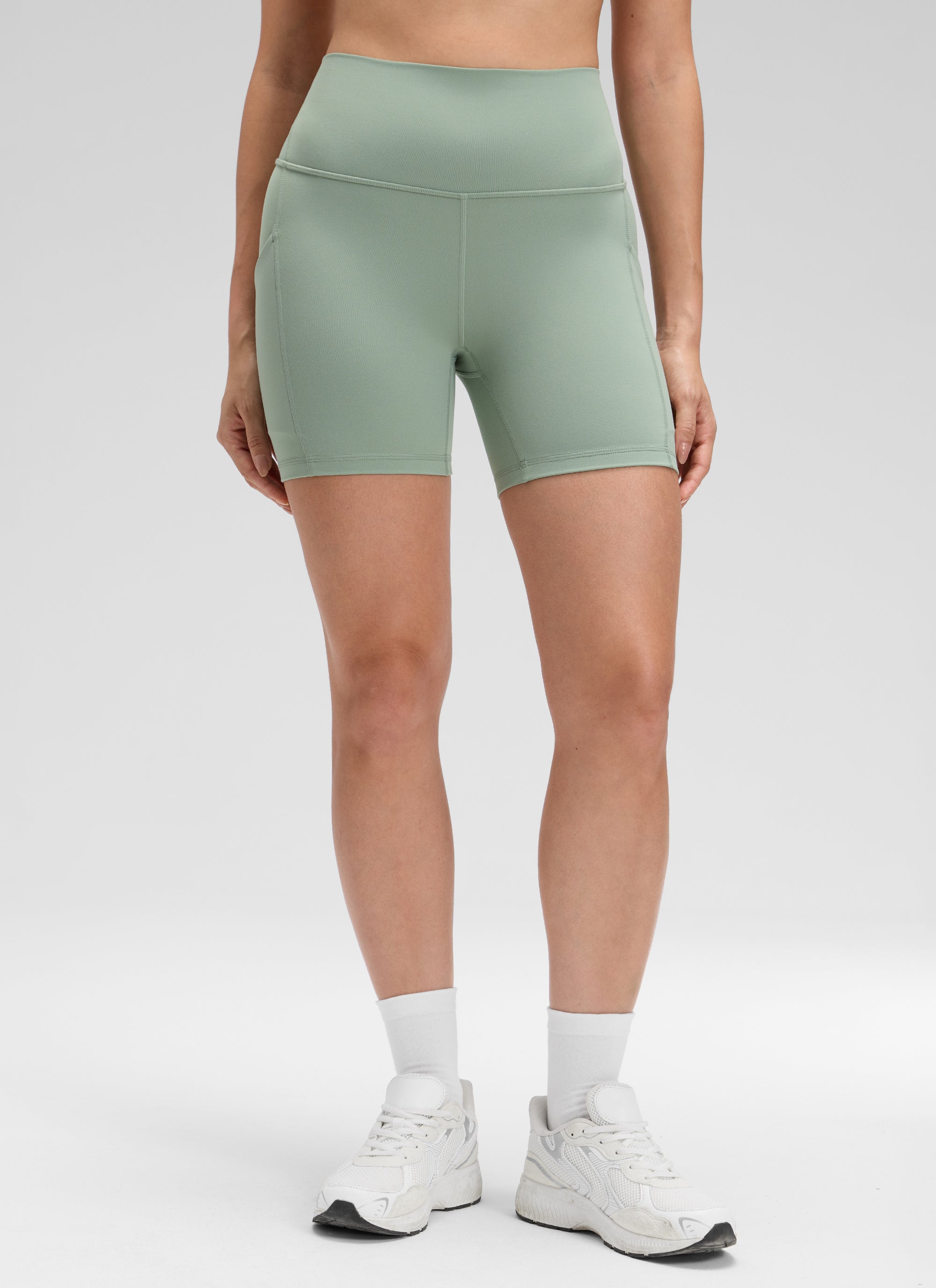 CRZ YOGA Women's Yoga High Rise Biker Butterluxe Pockets Shorts 5'' Green Palm Court @model_info:Bruna