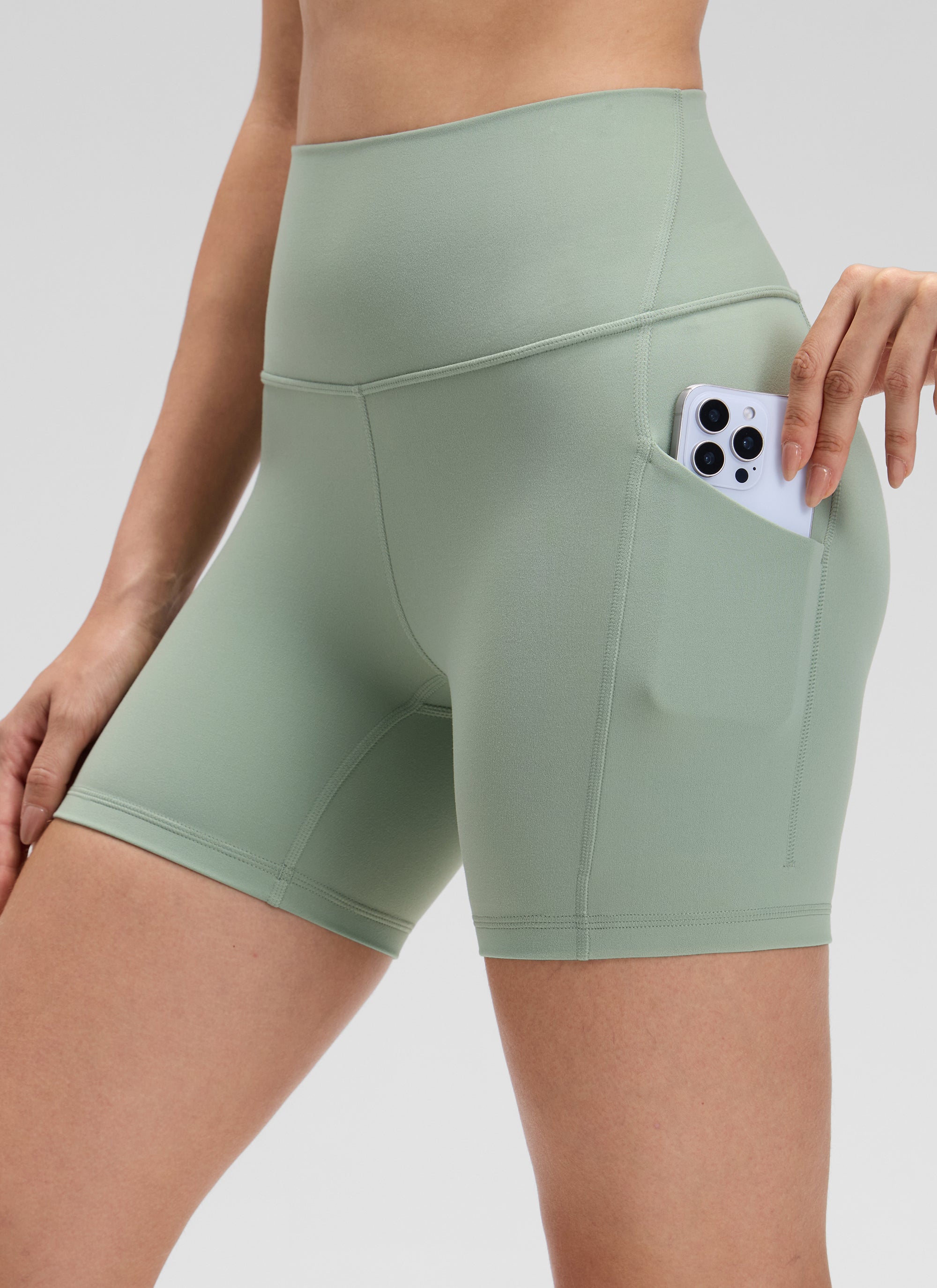CRZ YOGA Women's Yoga High Rise Biker Butterluxe Pockets Shorts 5'' Green Palm Court @model_info:Bruna