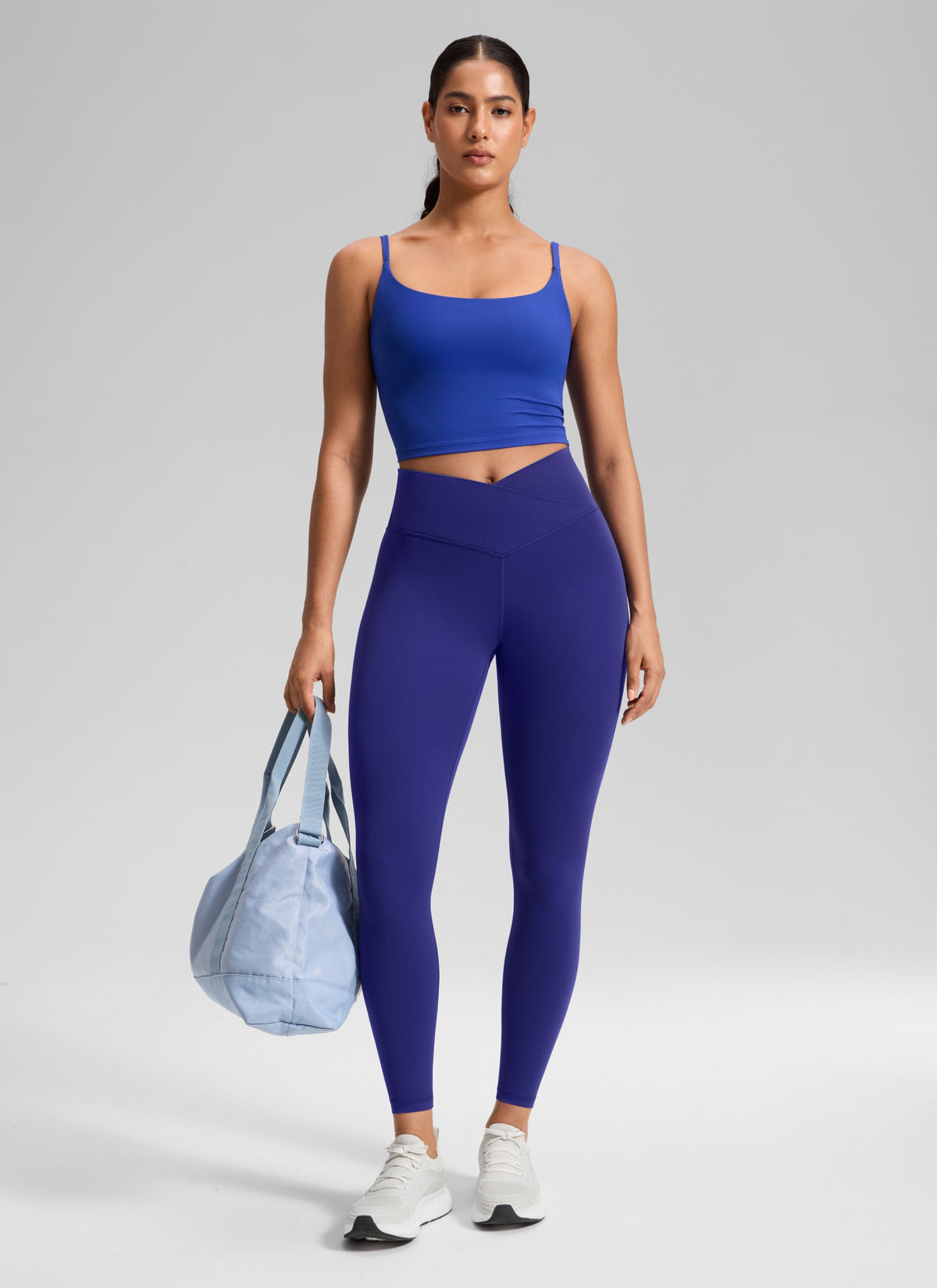 CRZ YOGA Women's High Rise Butterluxe Yoga Leggings 25'' V Cross Waist Larkspur Blue @model_info:Carol