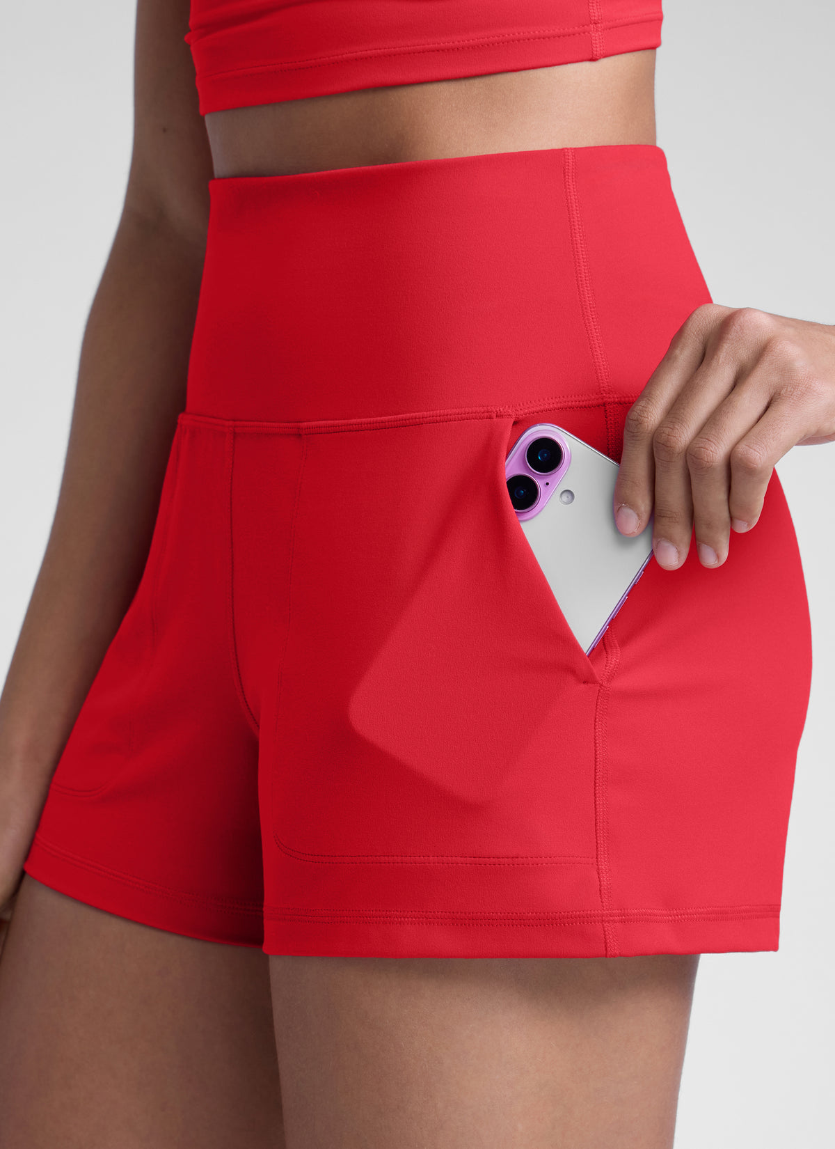 CRZ YOGA Women Butterlift High Waisted Shorts with Pockets Linerless Aurora Red @model_info:Dany