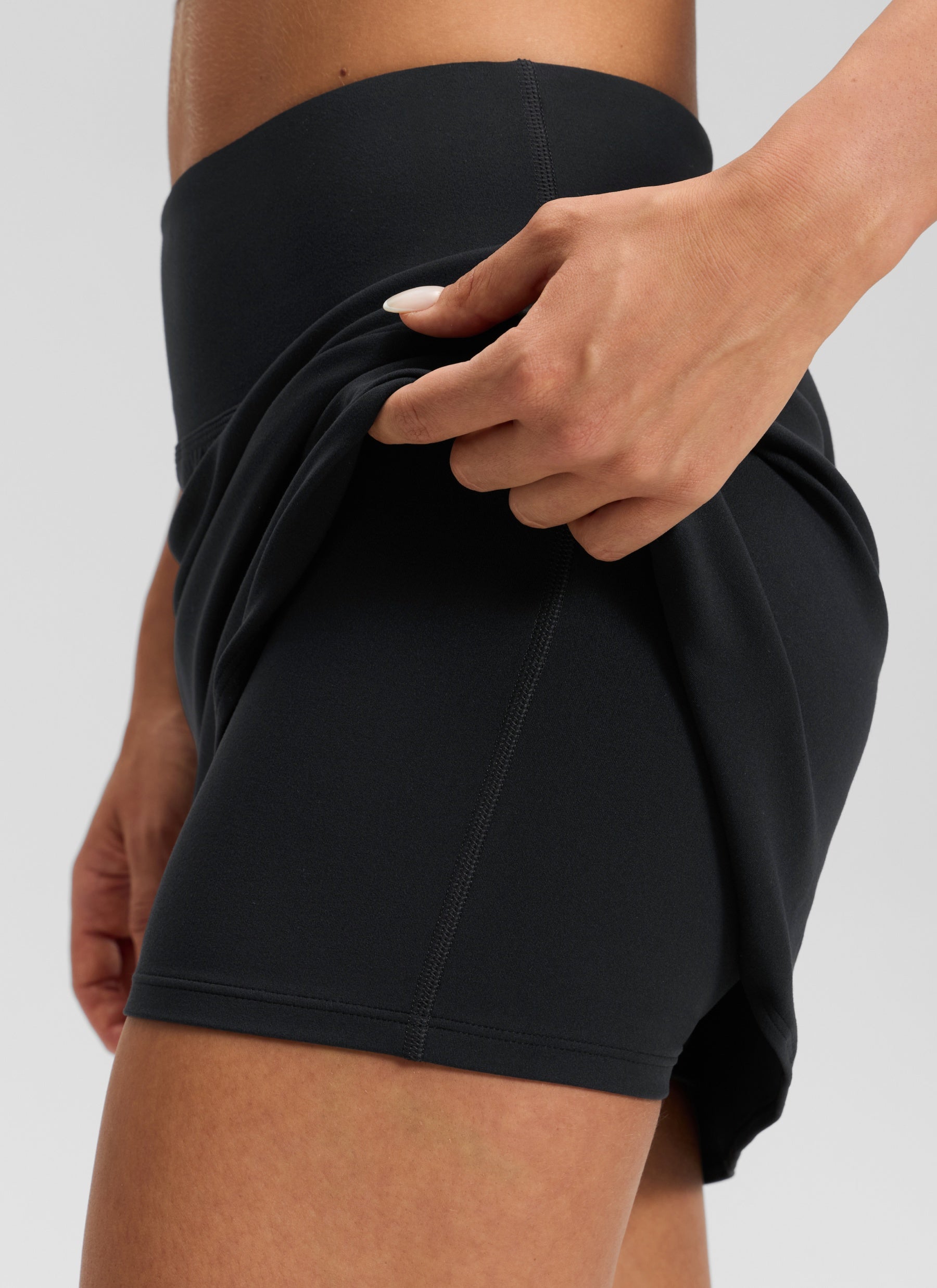 CRZ YOGA Women's Butterluxe Casual High Rise Dolphin Skirt 14.8'' Black @model_info:Isidora