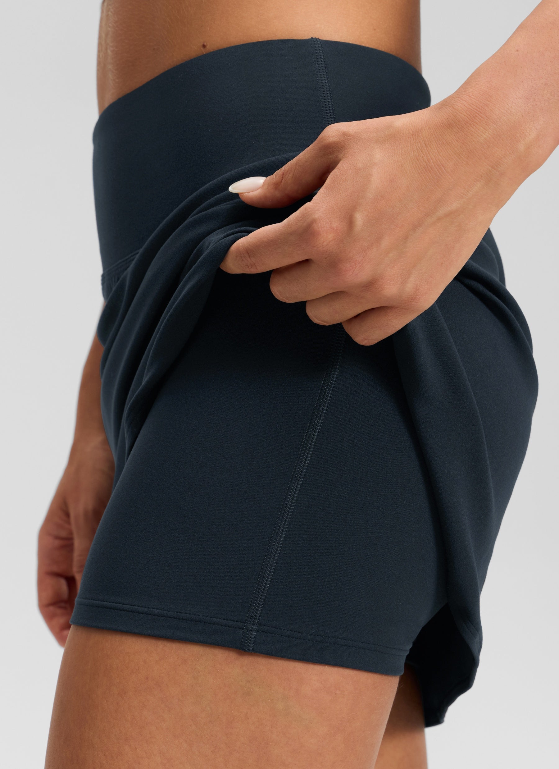 CRZ YOGA Women's Butterluxe Casual High Rise Dolphin Skirt 14.8'' True Navy @model_info:Isidora